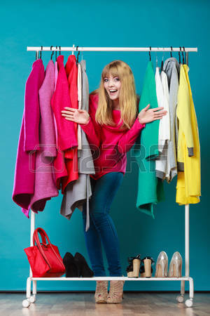 49008503-happy-woman-choosing-clothes-in-wardrobe-girl-customer-shopping-in-mall-shop-fashion-clothing-sale
